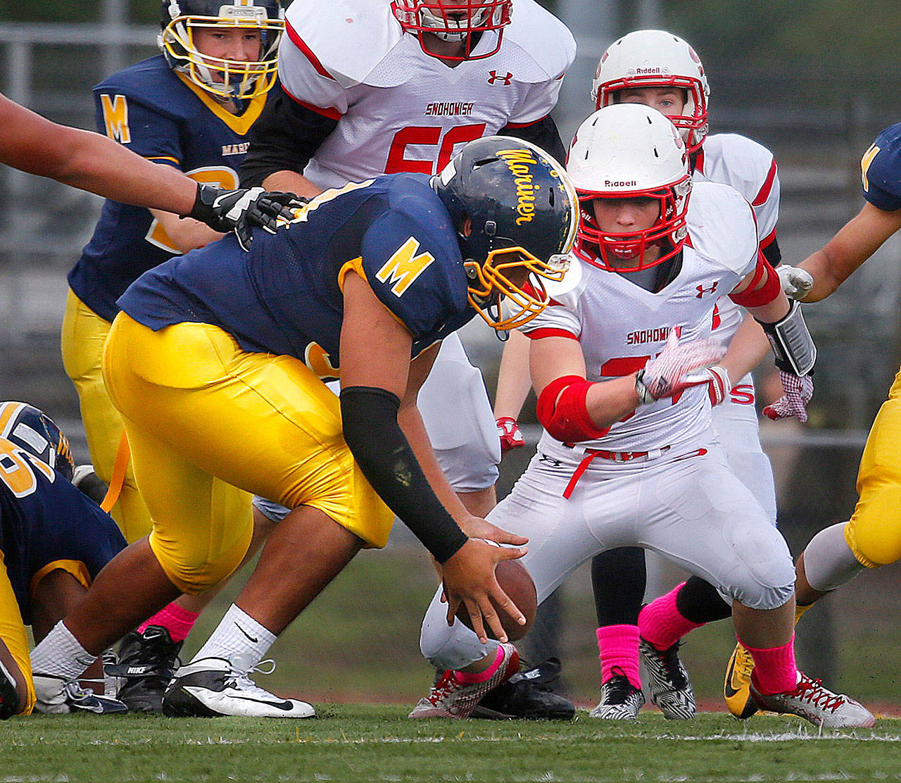 Bubba Isaia of Mariner recovers a fumble during a 2014 game against Snohomish in his sophomore season. (Annie Mulligan / The Herald, file)