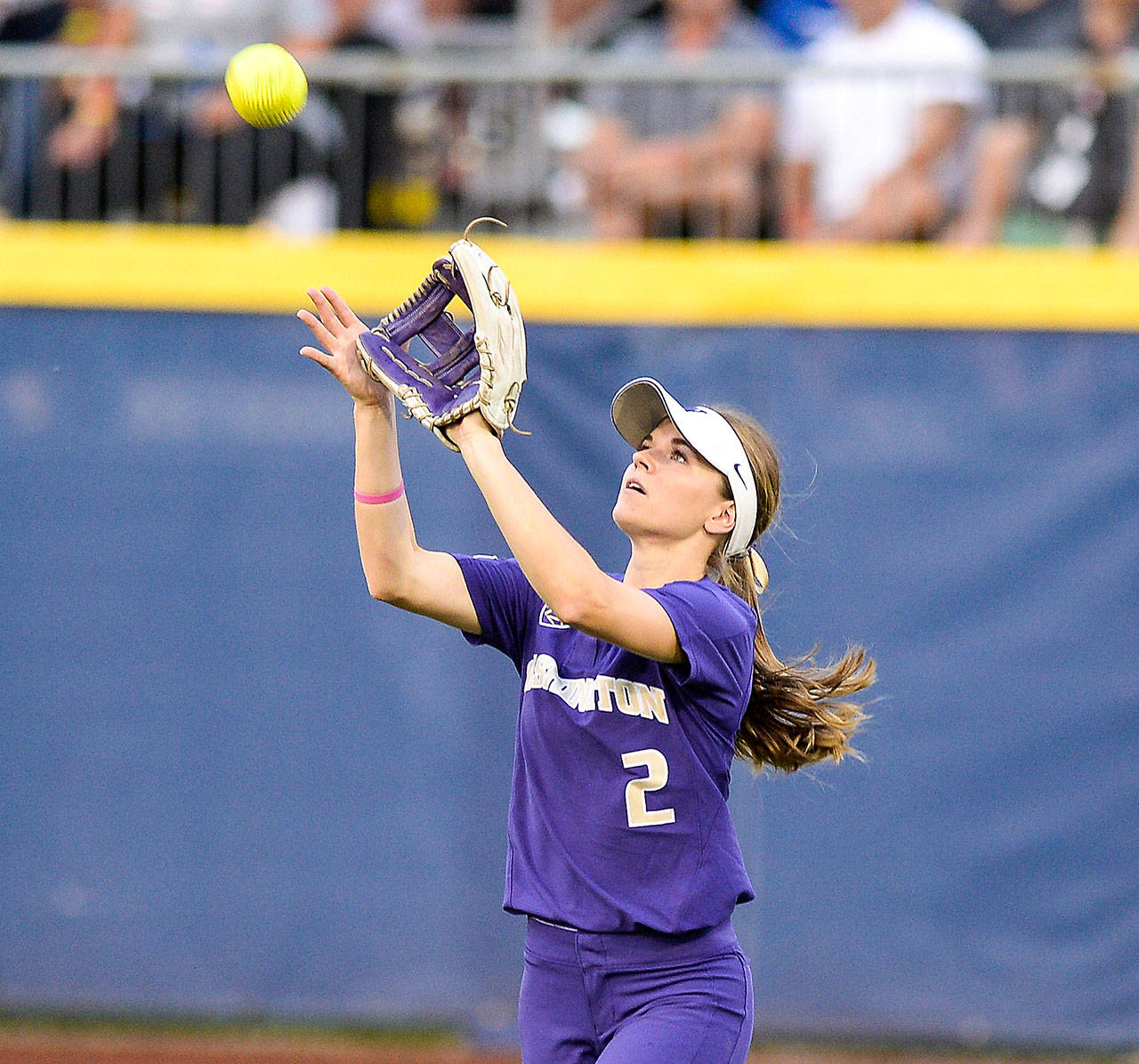 University of Washington outfielder Trysten Melhart, a graduate of Snohomish High School, catches a flyball during one of the Huskies’ games at the recent Women’s College World Series. (University of Washington photo)