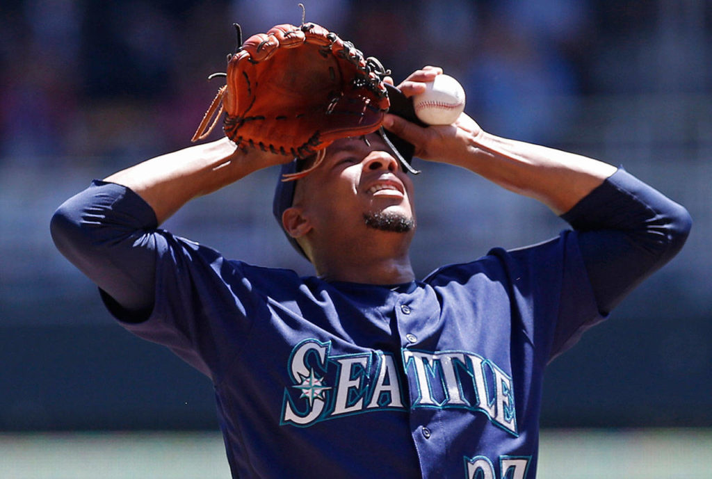 Seattle Mariners starting pitcher Ariel Miranda composes himself during the first inning of Thursday’s game against the Minnesota Twins. Miranda gave up five runs in the first inning. (AP Photo/Jim Mone)
