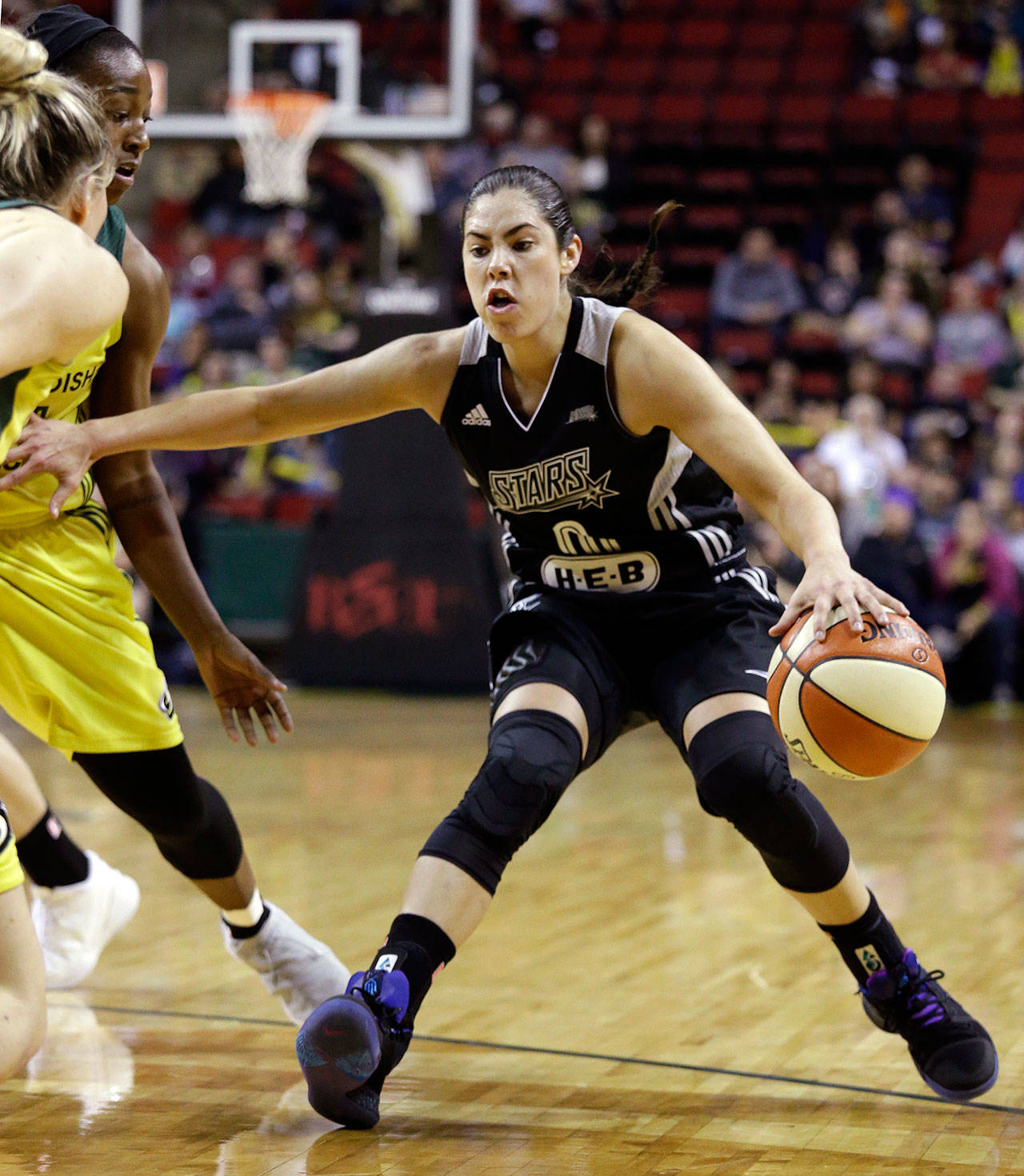Elaine Thompson / Associated Press                                San Antonio guard Kelsey Plum drives against the Seattle Storm in the first half of Sunday’s WNBA game in Seattle. Plum scored eight points in her team’s loss.