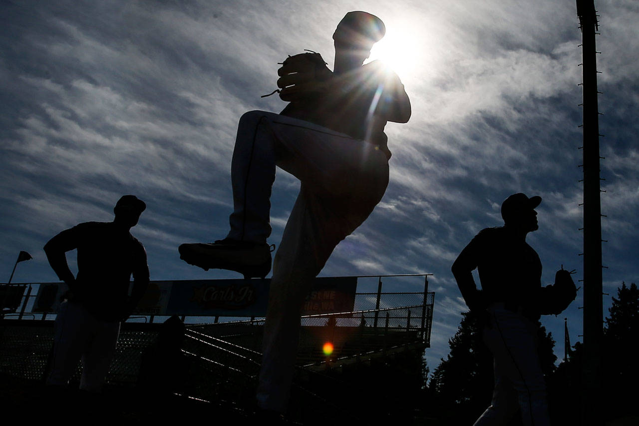 Members of the pitching core warm up during the Aquasox’s first day of training at Everett Memorial Stadium in Everett on June 11, 2017. (Kevin Clark / The Herald)