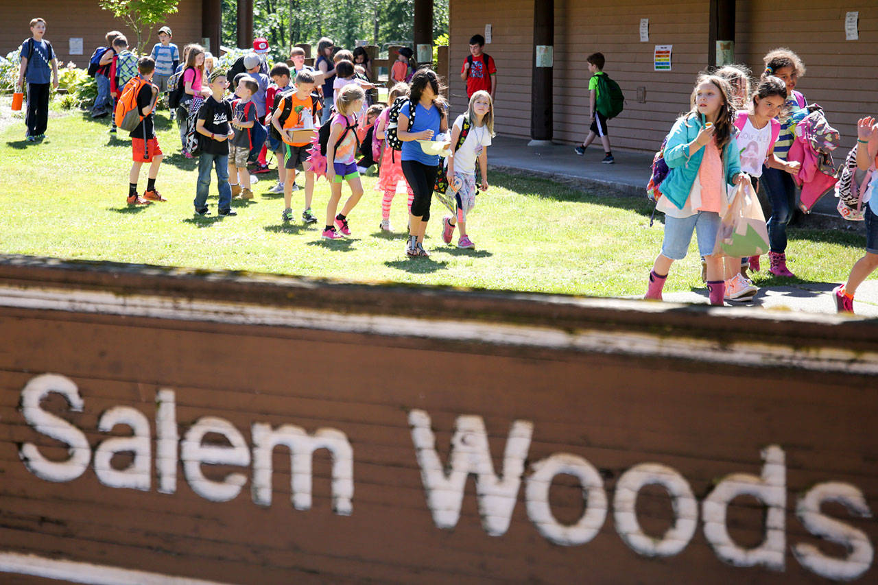 Students leave school for the final full day of classes at Salem Woods Elementary in Monroe on Thursday. As part of a 2015 bond measure, the school is getting overhauled over the next year. (Kevin Clark / The Herald)