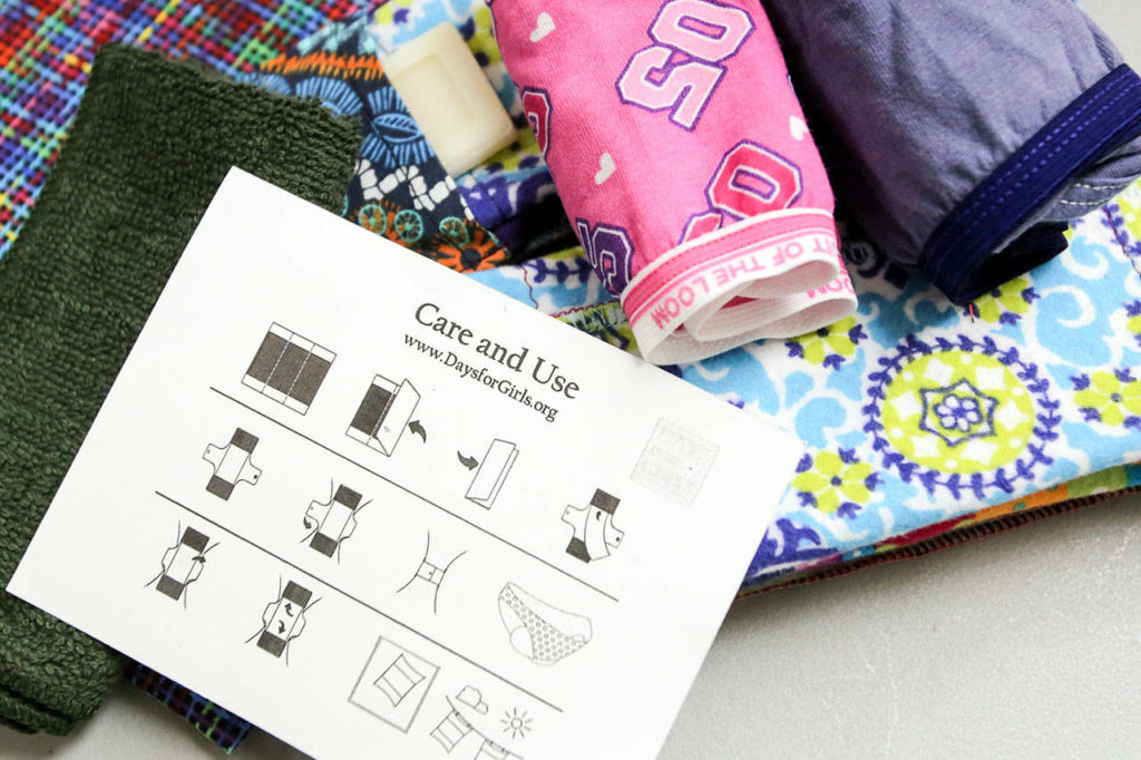 Liners, soap, panties, a towel and instructions are assembled in bags for distribution to women around the world Saturday morning at Bethel Baptist Church in Everett on June 17, 2017. (Kevin Clark / The Herald)
