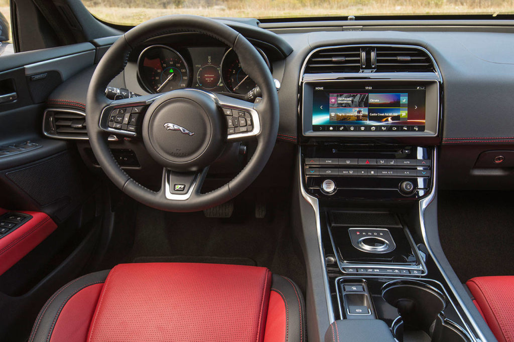 The 2017 Jaguar XE interior looks and feels plenty upscale, and the Big Cat logo on the steering wheel still impresses. (Manufacturer photo)

