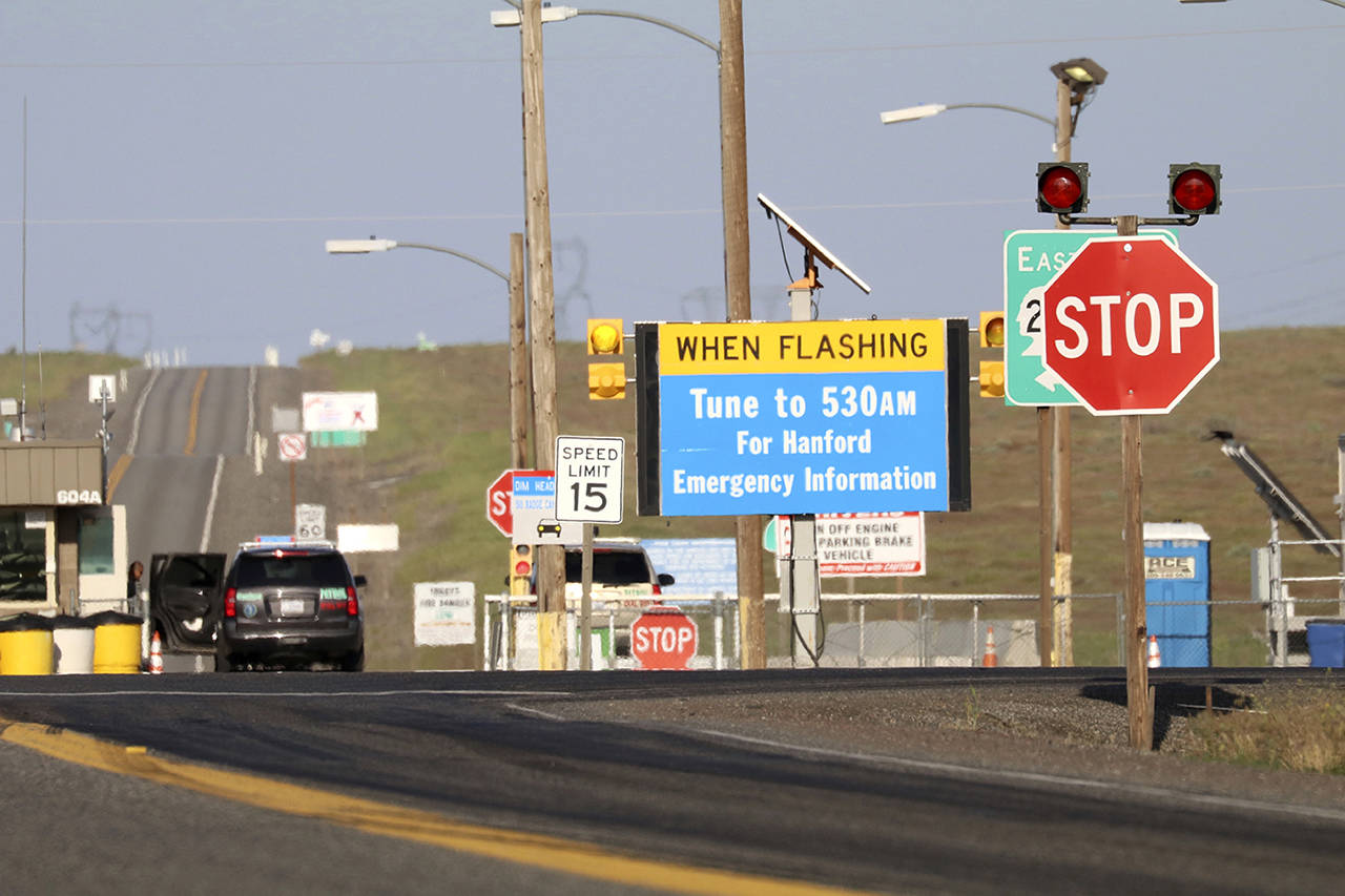 In this May 9 photo, an emergency sign flashes outside the Hanford Nuclear Reservation near Richland. Radiation warning alarms sounded about 7 a.m. on June 8, outside the Plutonium Finishing Plant, prompting about 350 workers at the Reservation to seek cover indoors. (AP Photo/Manuel Valdes, file)