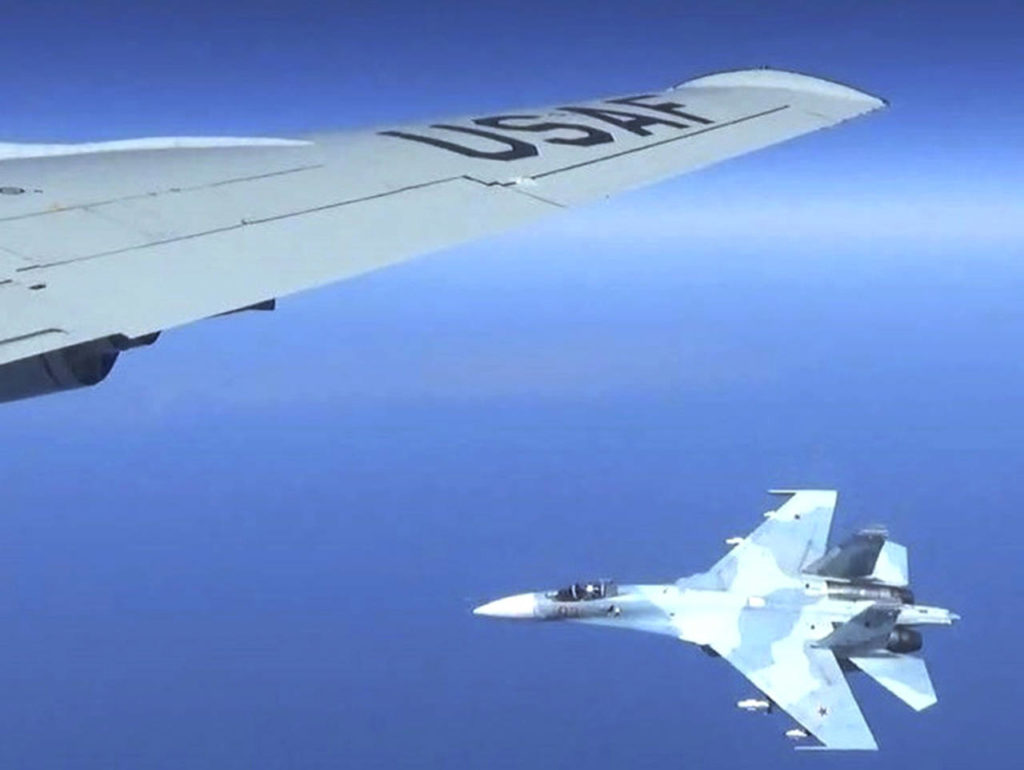A Russian jet comes within a few feet of a U.S. Air Force reconnaissance jet over the Baltic Sea on June 19. ( Master Sgt Charles Larkin Snr/U.S. European Command via AP)
