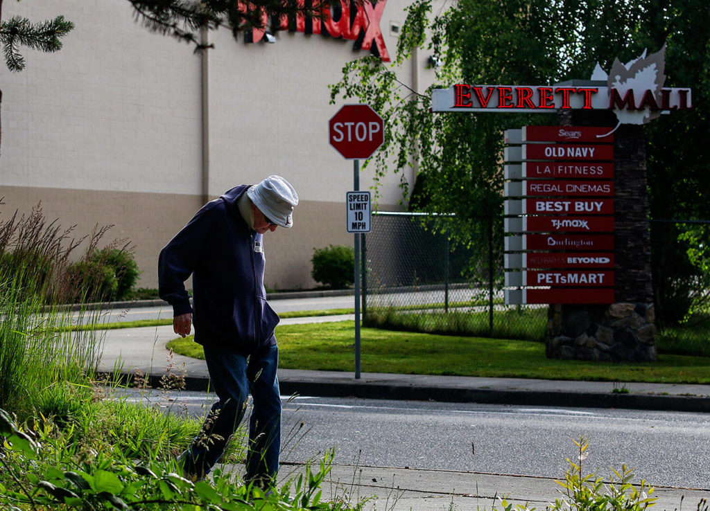 After walking past the Everett Mall, Williams makes his way to 100th Street SE. Since May 2, 2002, Williams has walked six miles each day, always following the same routes. (Dan Bates / The Herald)
