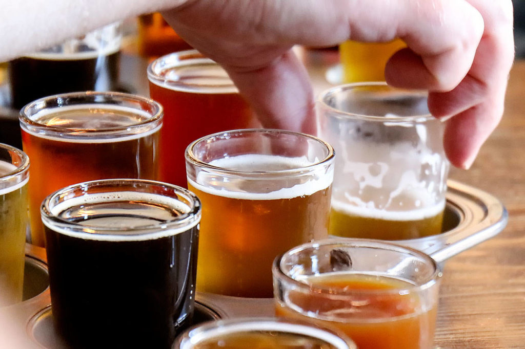 Microbrew samples at Sound to Summit are featured during the inaugural Soho Brew Tour in Snohomish on June 24. (Kevin Clark / The Herald)
