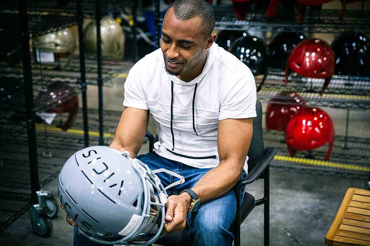 In this April 26 image, Seattle Seahawks NFL football player Doug Baldwin talks about the new VICIS Zero 1 helmet that NFL teams will be trying out at minicamps, at a fabrication facility in Seattle. (Randy Ronquillo/VICIS Inc. via AP)