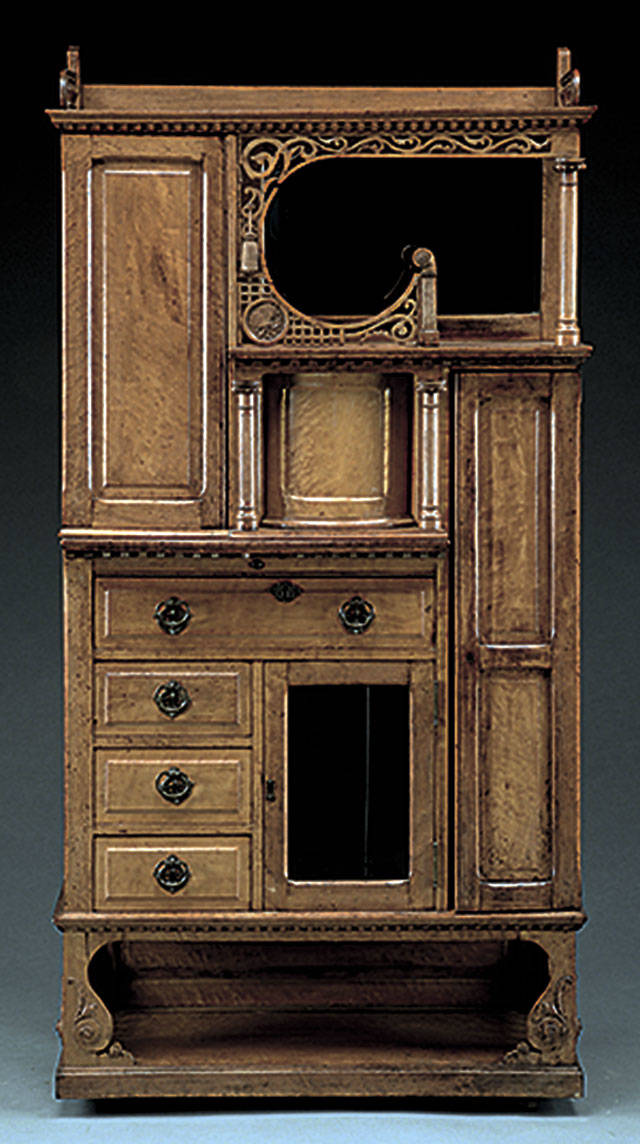 This strange cabinet was made in the 19th century to display many small, unusual items, known then as curiosities. It auctioned for $1,936. (Cowles Syndicate Inc.)