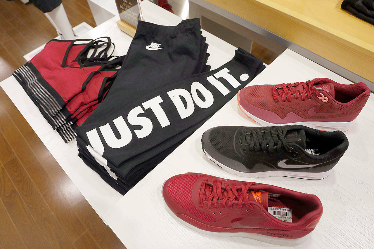 Nike products appear on display at the SIX:02 shop inside Foot Locker’s redesigned Manhattan flagship store in New York on Aug. 25. On Thursday, June 15, 2017, Nike said it plans to cut about 1,400 jobs, reduce the number of sneaker styles it offers by a quarter and sell more shoes directly to customers online. The company says the changes to its business structure will help it offer more products to customers faster. (AP Photo/Mary Altaffer, File)