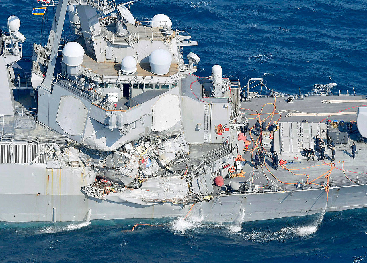 The damage of the right side of the USS Fitzgerald is seen off Shimoda, Shizuoka prefecture, Japan, after the Navy destroyer collided with a merchant ship, Saturday. The U.S. Navy says the USS Fitzgerald suffered damage below the water line on its starboard side after it collided with a Philippine-flagged merchant ship. (Iori Sagisawa/Kyodo News via AP)