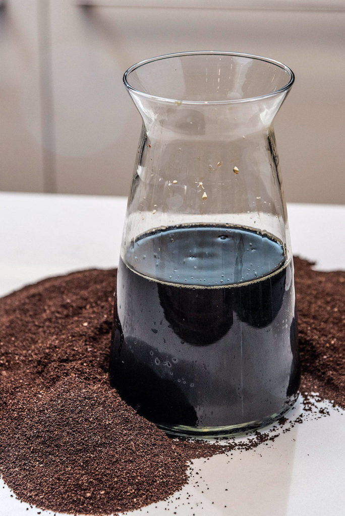 Basic cold-brew coffee is made by refrigerating a container of cold water and ground coffee overnight. Strain it several times to remove the grounds from the concentrate. (Roy Inman/Kansas City Star)
