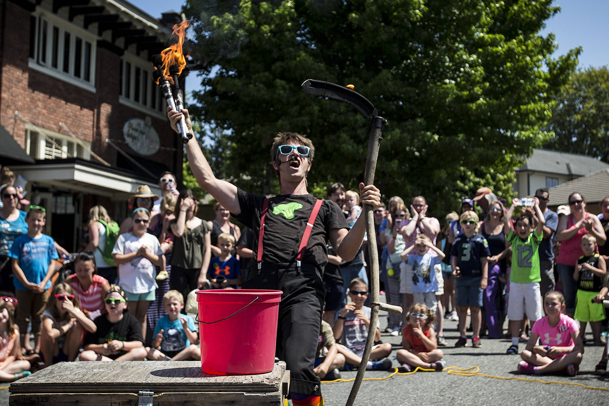 Circus performer Jules McEvoy, of Bellingham, dazzles the crowd gathered for the Kla Ha Ya Days festival in downtown Snohomish on Saturday. (Ian Terry / The Herald)
