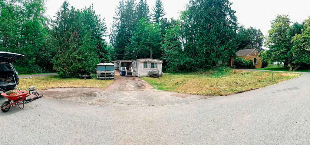 AFTER: Here’s the cleaned up condition in which the Wells Fargo volunteers left the yard. (Homage photo)

