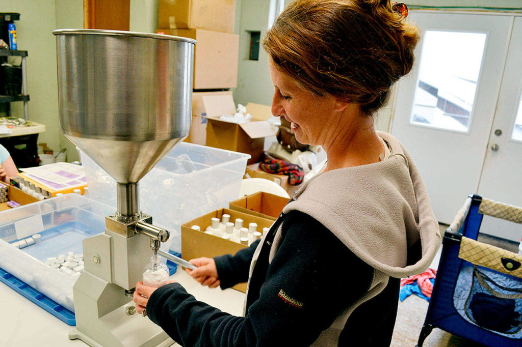 Kristy Hilliker, co-owner of B&B Family Farm, prepares lavender lotion prior to last year’s Sequim Lavender Weekend. This year, she and her husband Zion added 2,500 lavender plants to the farm. (Sequim Gazette file photo by Matthew Nash)
