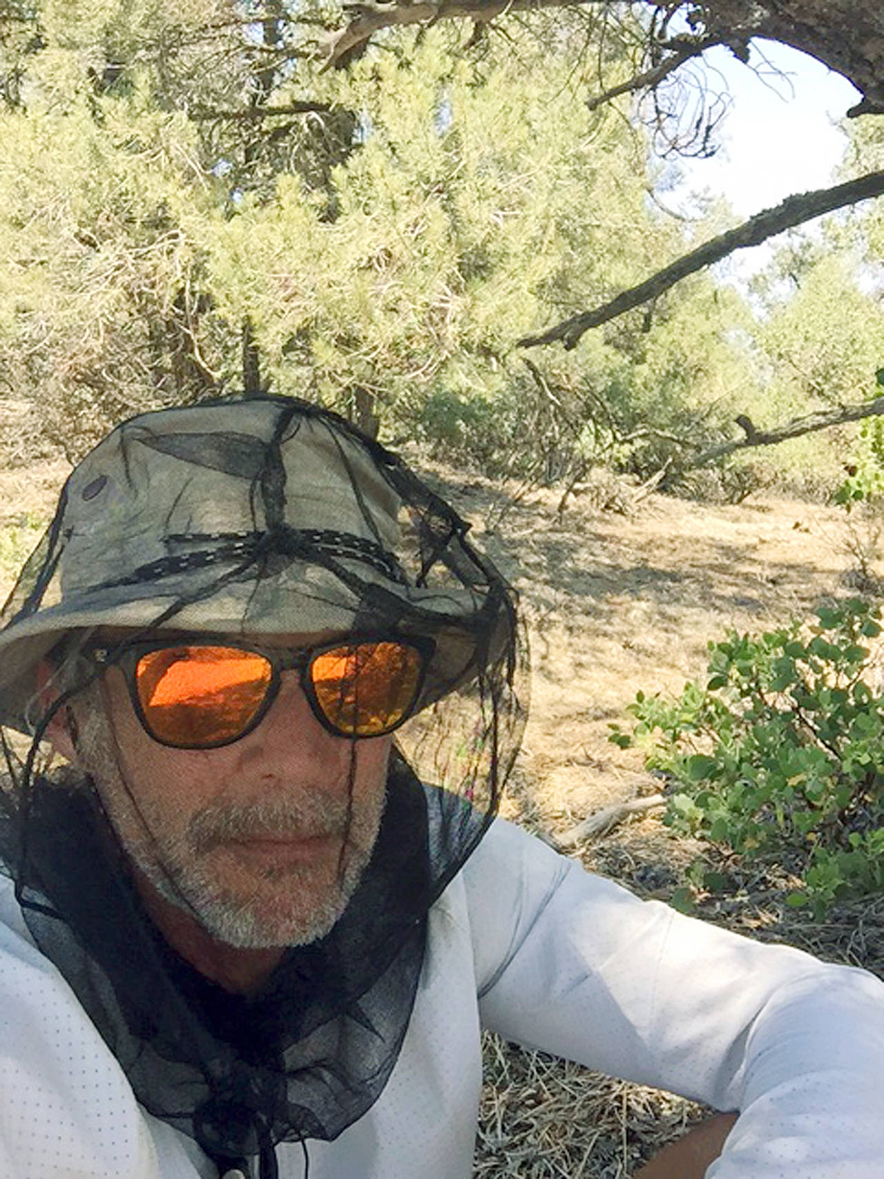 This July 6 photo provided by Charles Brandenburg shows his self portrait taken along the Pacific Crest Trail near Tehachapi, California. Volunteer rescuers who were coming to the aid of Brandenburg, who had become dehydrated, were held up by armed men on the Pacific Crest Trail in the Piute Mountains, about 85 miles north of Los Angeles. Authorities closed the trail after the robbery and airlifted Brandenburg and three other backpackers trying to hike the 2,650-mile route from Mexico to Canada on the trail. (Charles Brandenburg via AP)