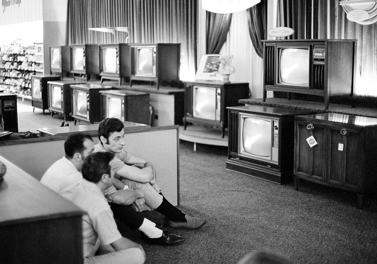 Men watch the Apollo 11 launch on TVs for sale at a Sears in White Plains, New York, on July 16, 1969. (Associated Press archive)