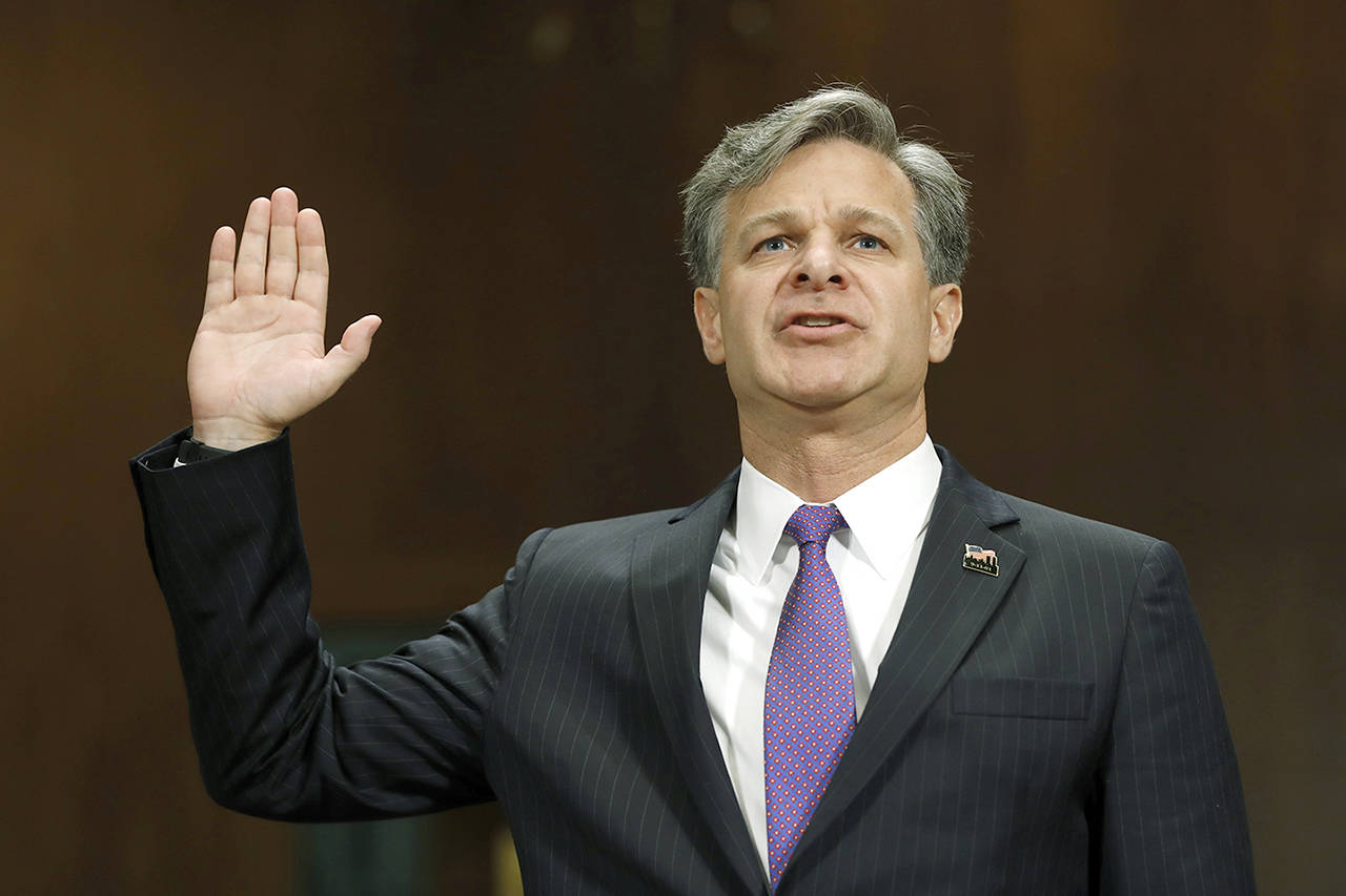 FBI Director nominee Christopher Wray is sworn-on on Capitol Hill in Washington on Wednesday, prior to testifying at his confirmation hearing before the Senate Judiciary Committee. (AP Photo/Pablo Martinez Monsivais)