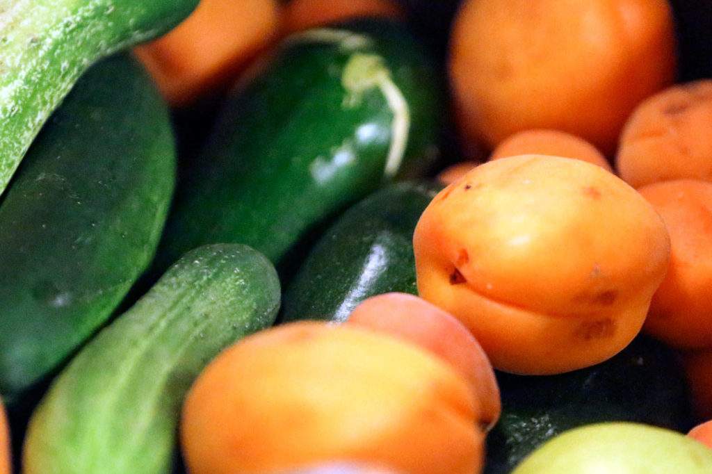 Leftover produce from the farmers market for local food banks Sunday afternoon on July 16, 2017. (Kevin Clark / The Herald)
