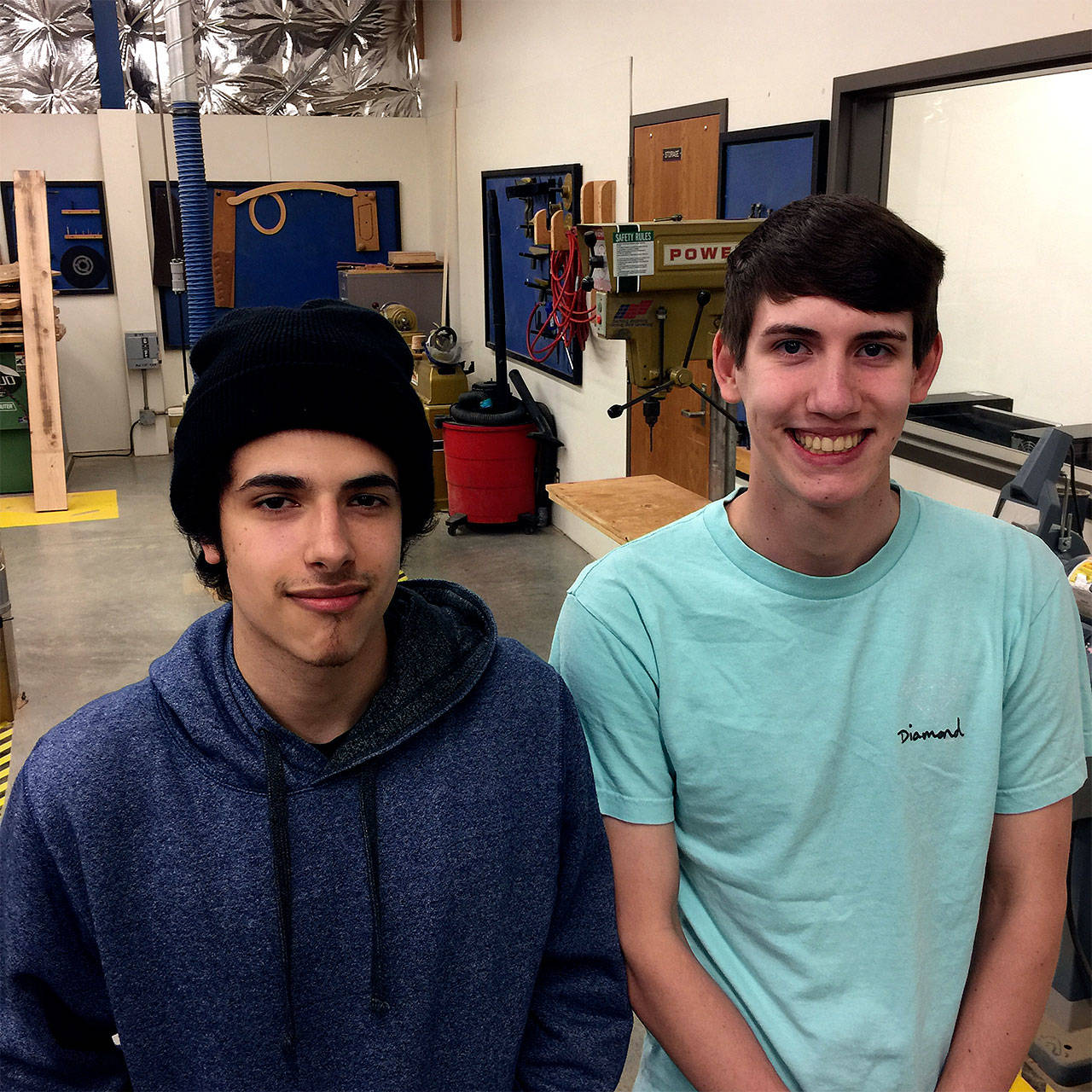 Sultan High School students Carlos Gonzalez and James Fortin recently renovated the welcome sign for the city of Gold Bar for a community service project. (Contributed photo)