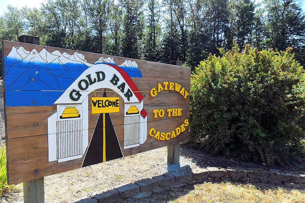 Sultan High School students Carlos Gonzalez and James Fortin renovated the welcome sign at the west side of the city of Gold Bar on U.S. 2. (Contributed photo)

