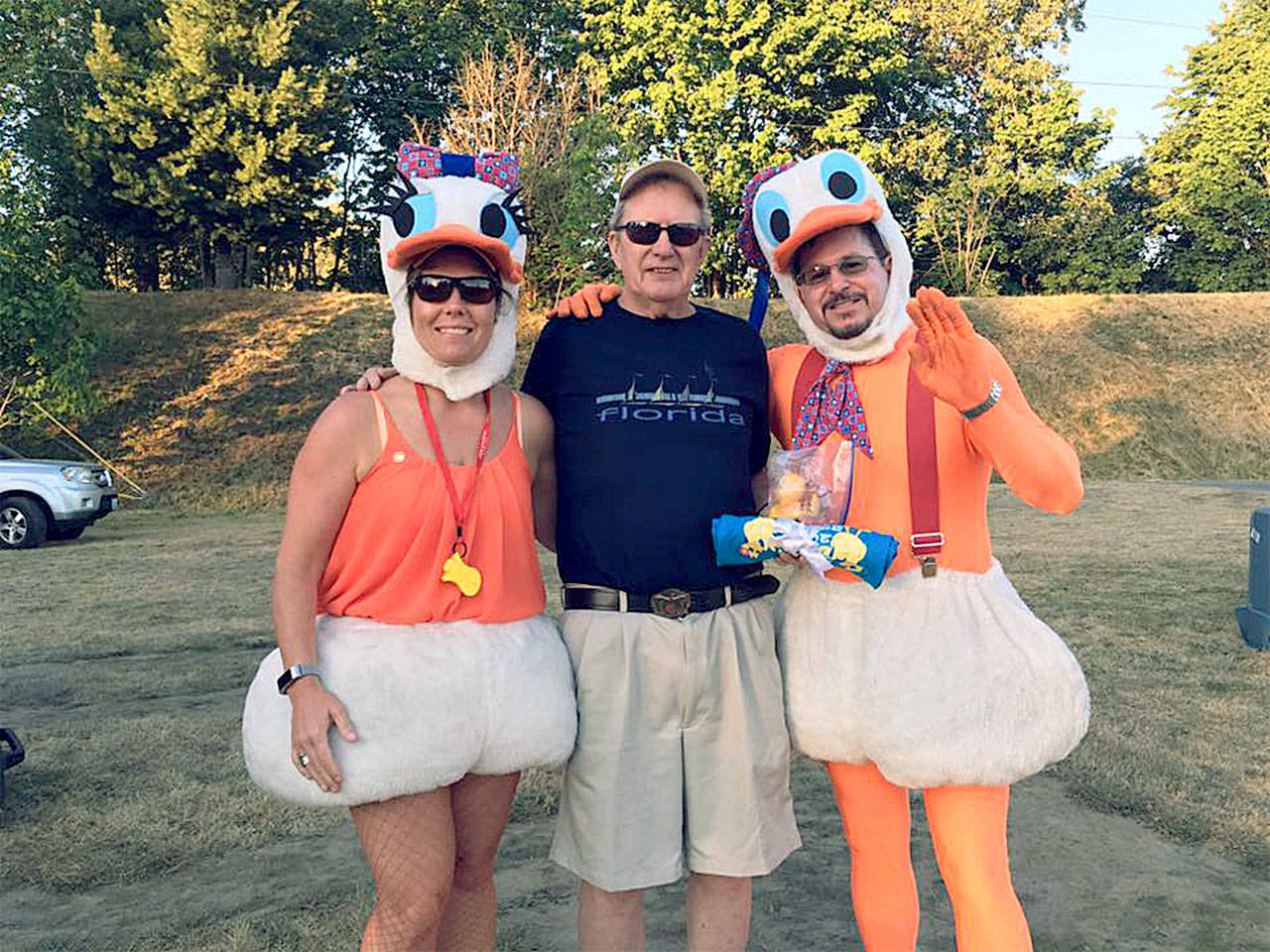 Ducks Carla Rankin Gastineau (left) and Jim Kelly (right) congratulate $1,000 winner Jon Knechtel at the 2017 Great Still Duck Dash. The Rotary Club of Arlington fundraiser this year brought in $82,200. (Contributed photo)