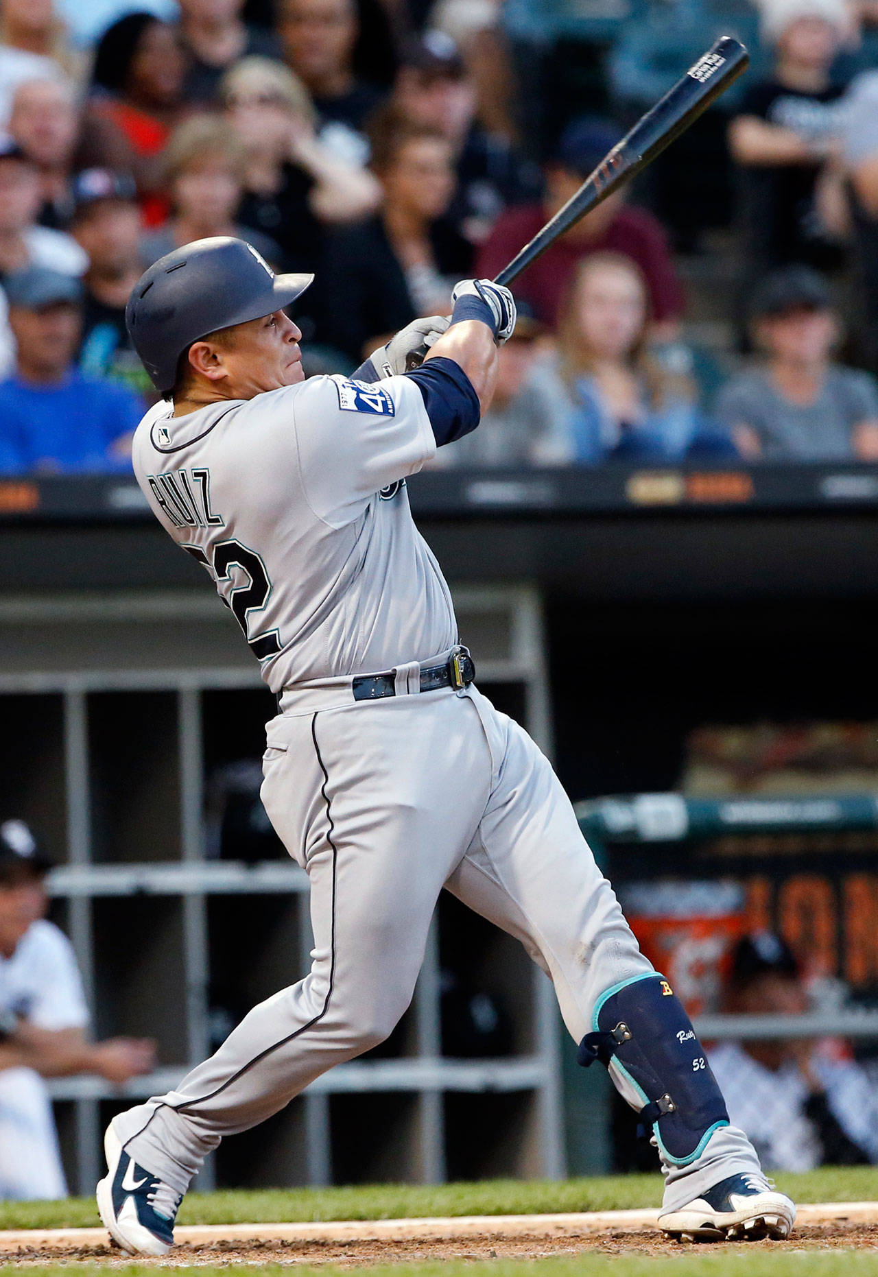 Seattle’s Carlos Ruiz hits an run-scoring single in the fifth inning of Saturday’s game in Chicago. (AP Photo/Nam Y. Huh)