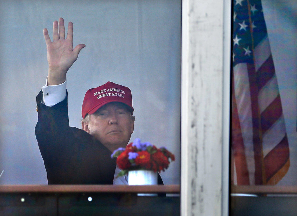 President Trump waves to spectators at the U.S. Women’s Open Golf tournament Saturday in Bedminster, New Jersey. (AP Photo/Seth Wenig)
