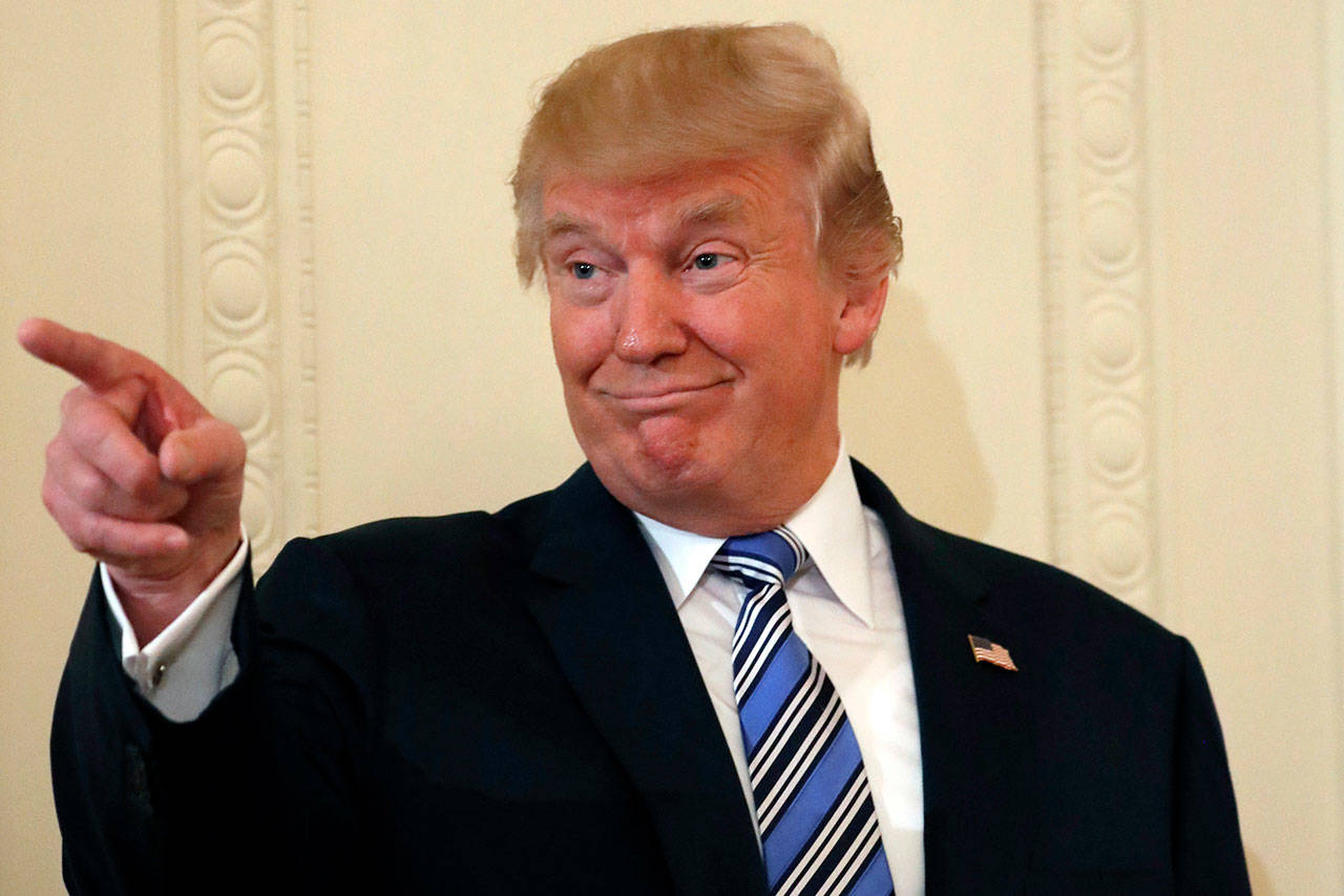 President Donald Trump points to a member of the audience before being introduced during a “Made in America” product showcase, featuring items created in each of the U.S. 50 states, at the White House on Monday. (AP Photo/Alex Brandon)