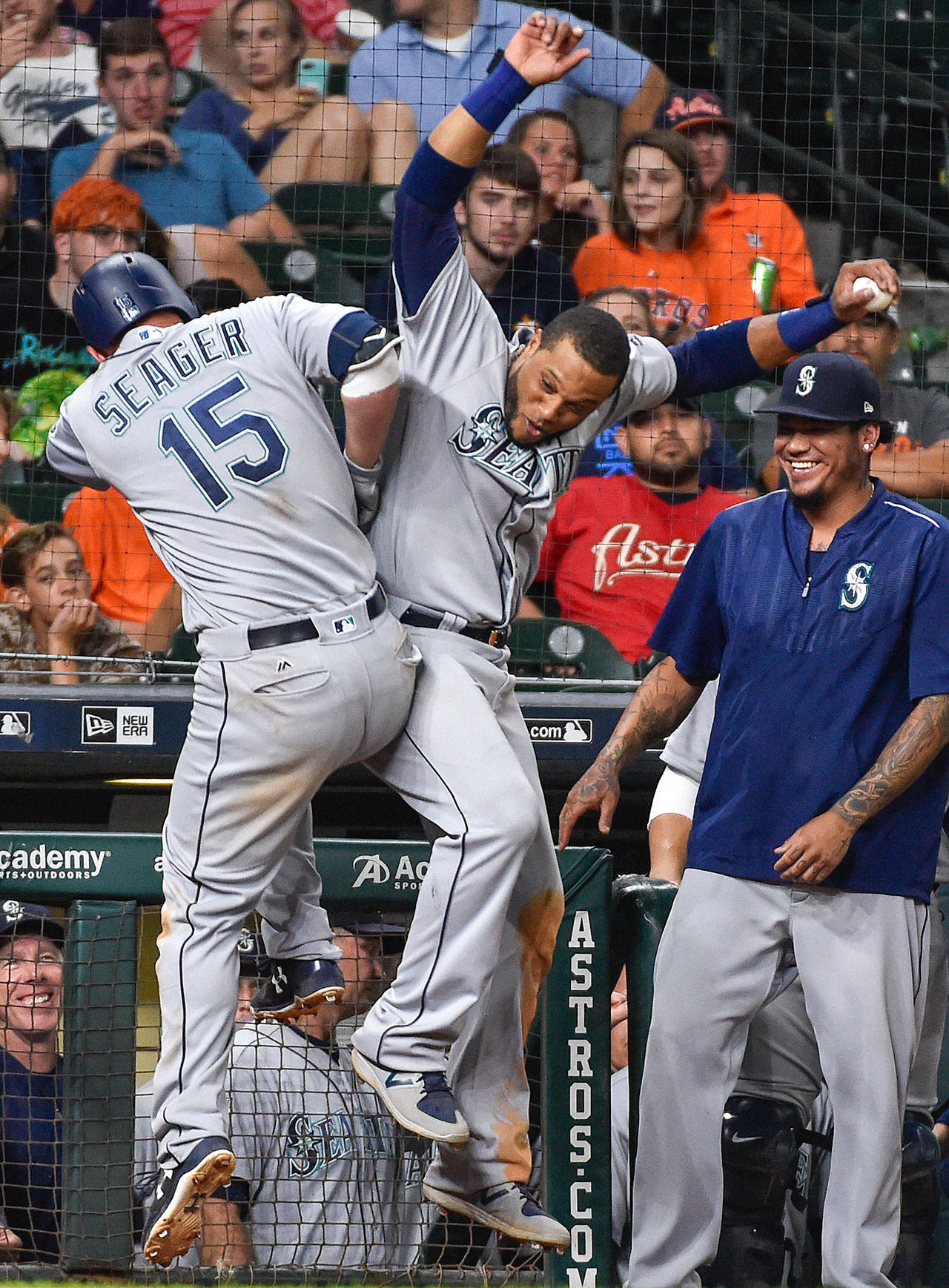 Seattle’s Kyle Seager celebrates his go-ahead home run with Robinson Cano during the 10th inning of Monday’s game in Houston. (AP Photo/Eric Christian Smith)