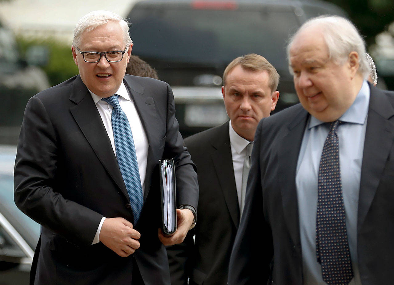 Russian Deputy Foreign Minister Sergei Ryabkov (left) and Russian Ambassador to the U.S. Sergey Kislyak (right) arrive at the State Department in Washington on Monday to meet with Undersecretary of State Thomas Shannon. (AP Photo/Carolyn Kaster)