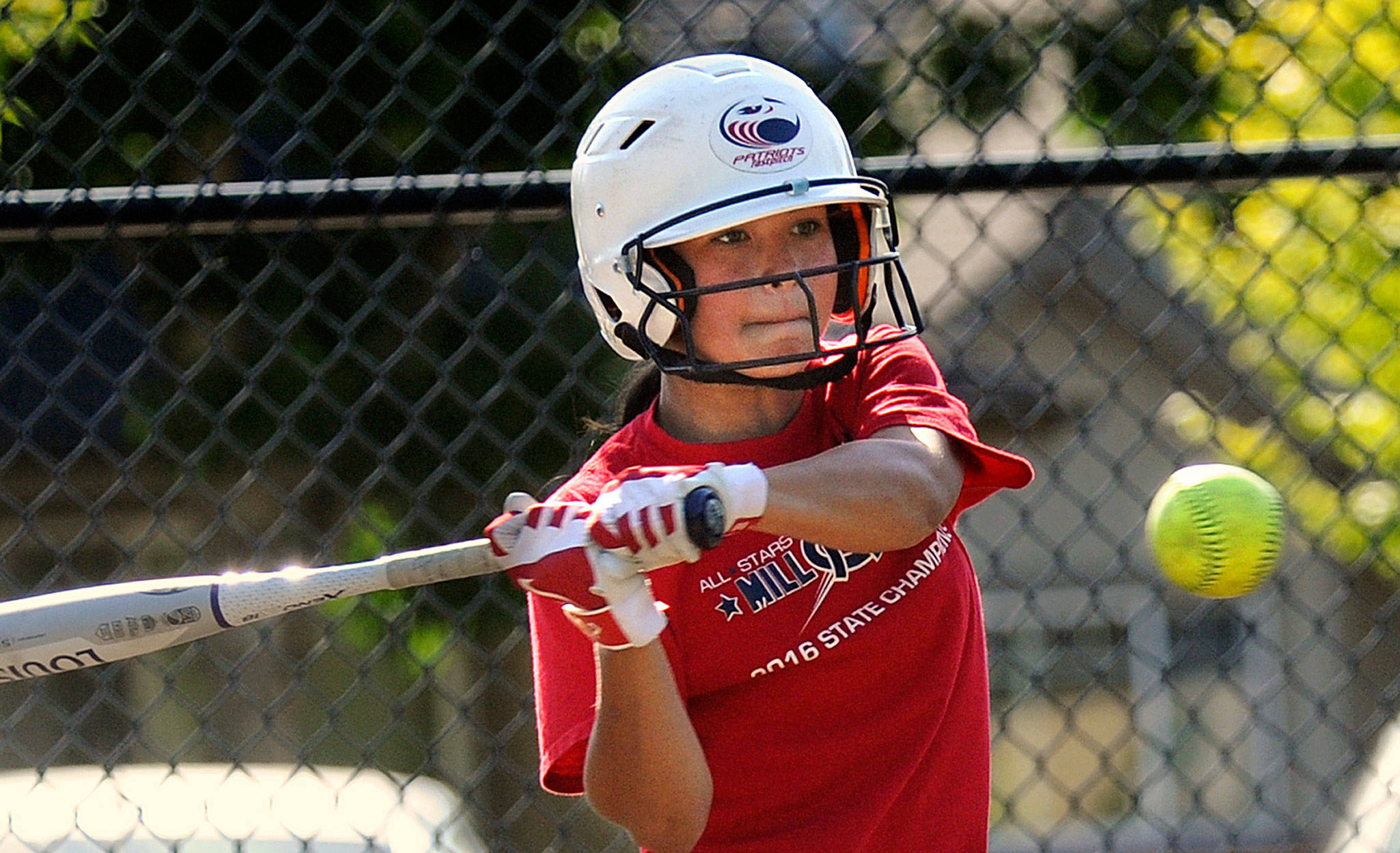 Mill Creek infielder Lauren Whitley takes a swing during practice on July 16, 2017, at Mill Creek Sports Park. (Doug Ramsay / For The Herald)