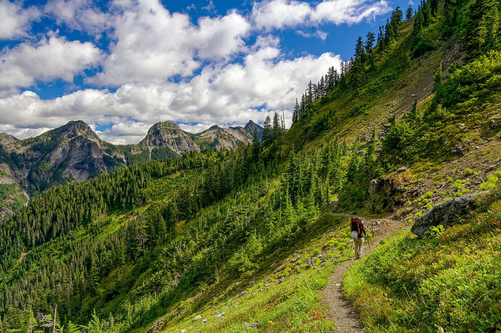 A backpacker hikes near High Pass in the North Cascades. (Photo by Kevin Mack)
