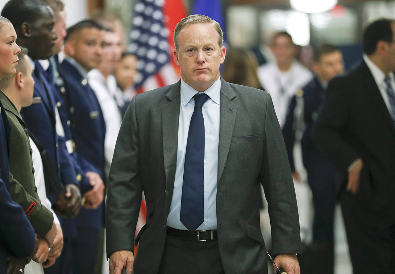 White House press secretary Sean Spicer walks down the hallway during President Donald Trump’s visit to the Pentagon on Thursday. (AP Photo/Pablo Martinez Monsivais)