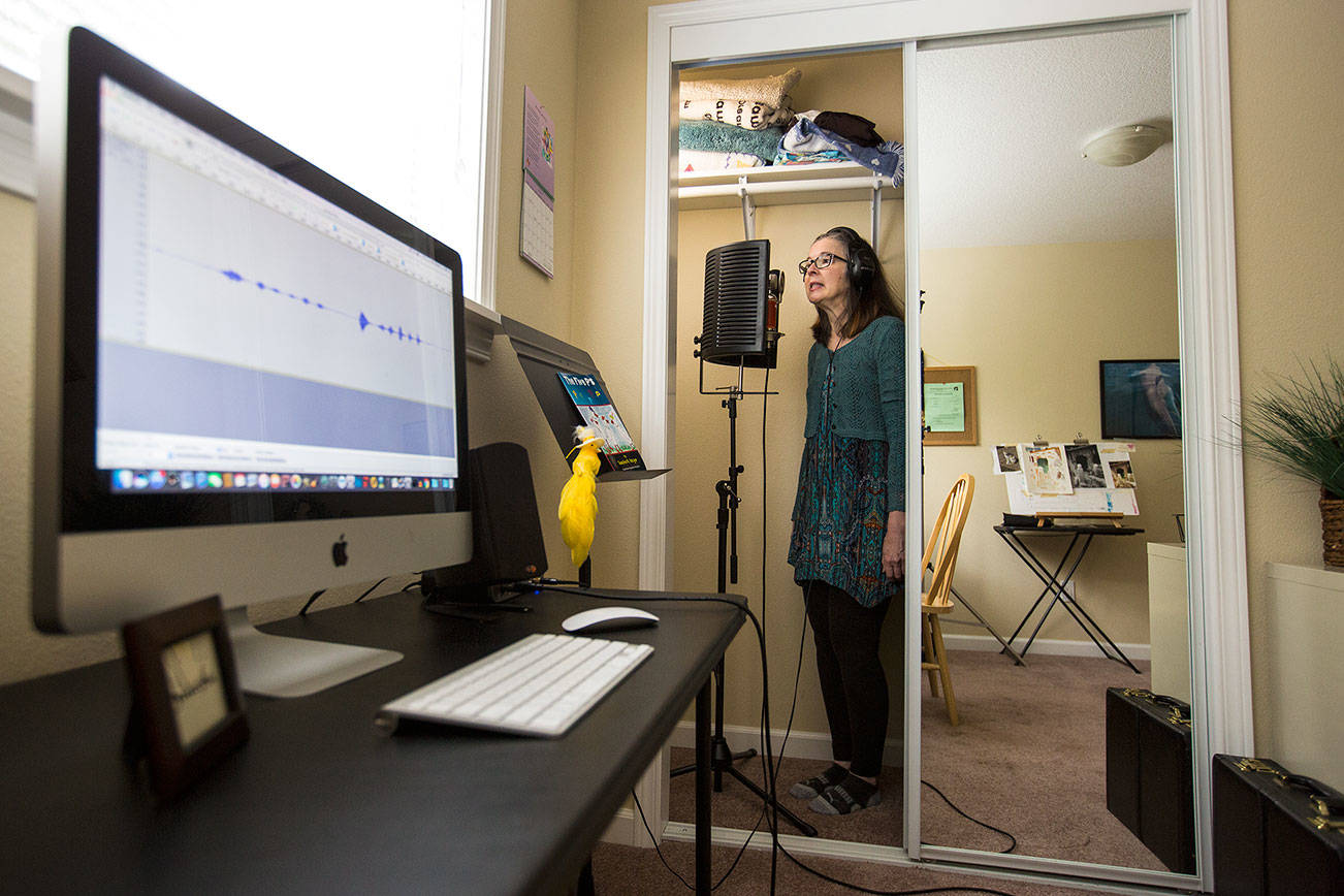 A computer records her voice as Saacha K. Belgar uses her closet as a recording studio when she needs to dampen sound more than usual on Wednesday, May 24, 2017 in Snohomish, Wa. (Andy Bronson / The Herald)