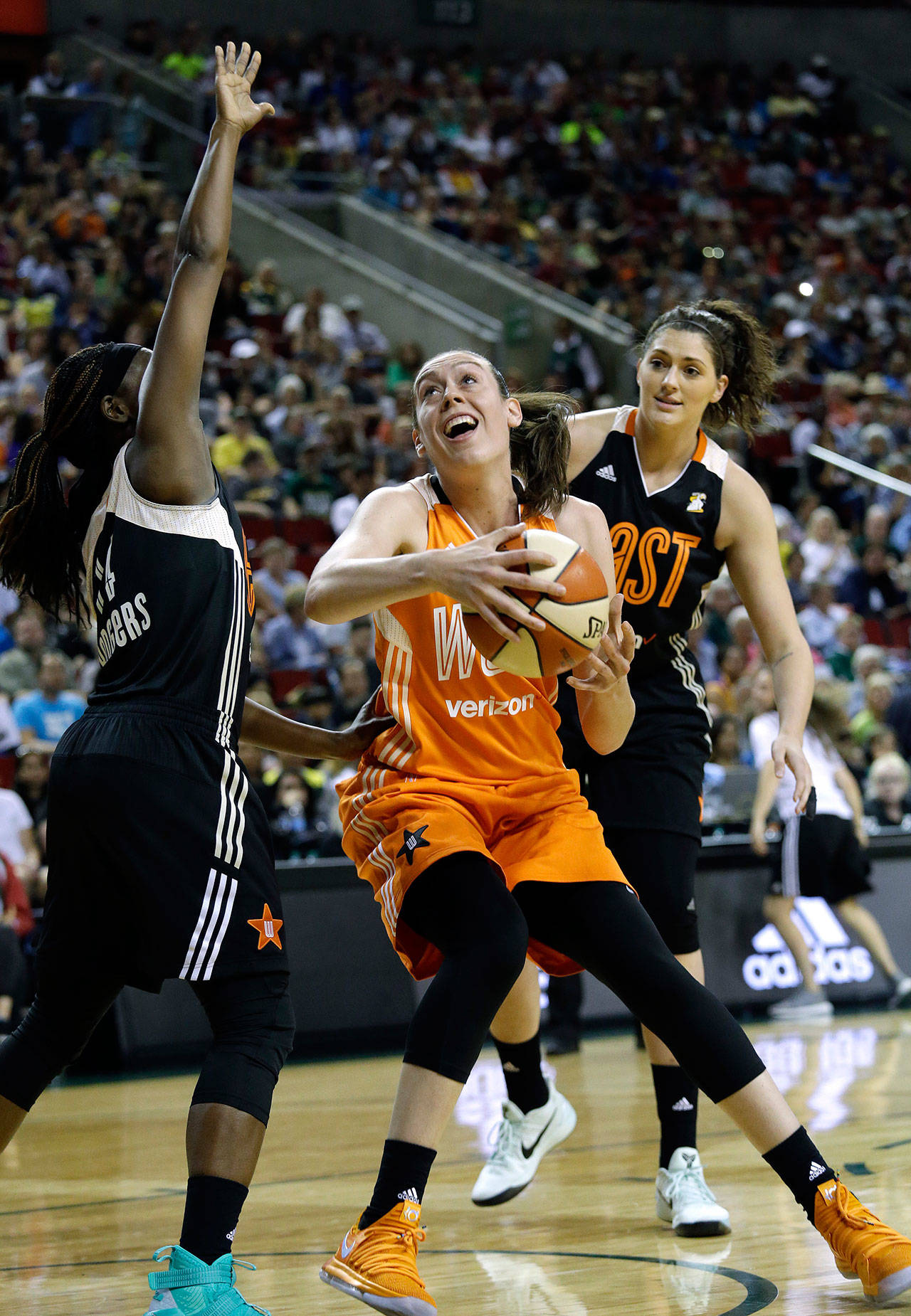 Western Conference center Breanna Stewart (center), of the Seattle Storm, prepares to shoot between Eastern Conference’s Sugar Rogers (left), of the New York Liberty, and Stefanie Dolson, of the Chicago Sky, in the second half of the WNBA All-Star game on July 22, 2017, in Seattle. (AP Photo/Elaine Thompson)
