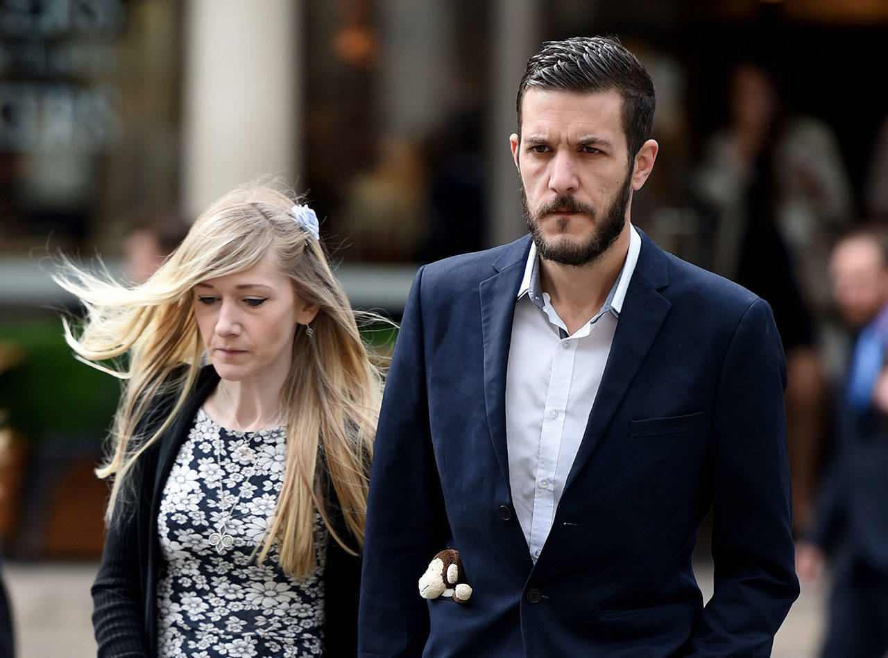 Charlie Gard’s parents Connie Yates and Chris Gard arrive at the Royal Courts of Justice in London where the hearing will resume into the case of their terminally-ill baby, Friday July 21, 2017. A British court is giving the parents of 11-month-old Charlie Gard a chance to present fresh evidence that their terminally ill son should receive experimental treatment. (Lauren Hurley/PA via AP)