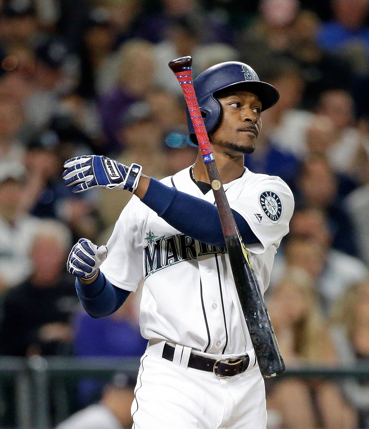 Seattle’s Jarrod Dyson tosses aside his bat after striking out against the New York Yankees during the eighth inning of Thursday’s game in Seattle. (AP Photo/Elaine Thompson)