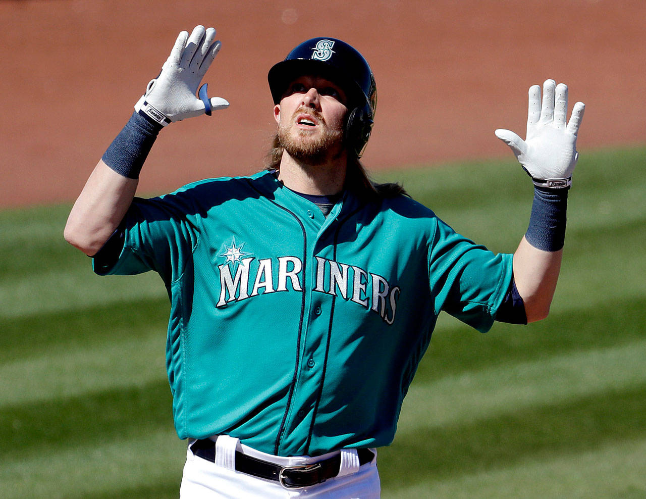 Seattle’s Taylor Motter celebrates after hitting a home run against the Texas Rangers during a Cactus League game in March in Peoria, Arizona. (AP Photo/Matt York)