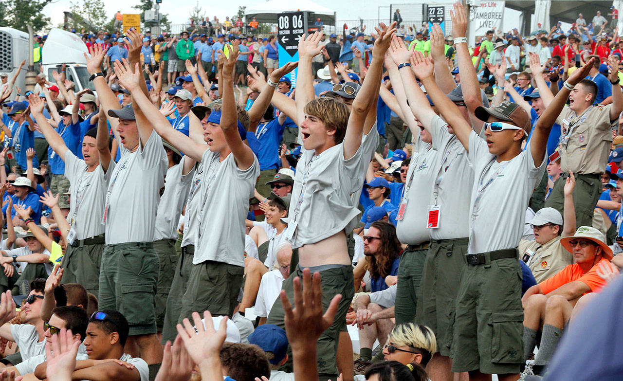 Boy Scouts sing and dance to music as they await the arrival of President Donald Trump at the 2017 National Boy Scout Jamboree at the Summit in Glen Jean, West Virginia on Monday. (AP Photo/Steve Helber)