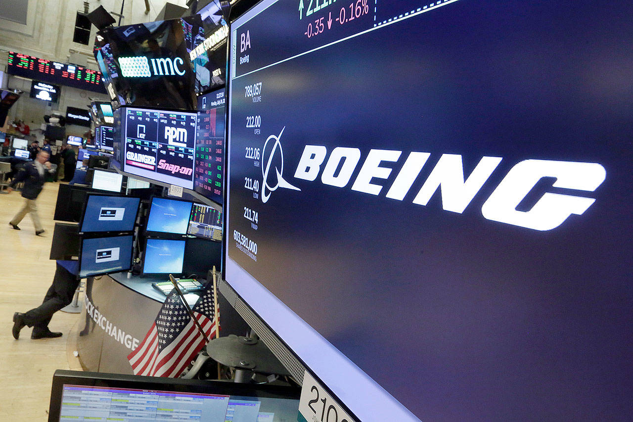 The Boeing logo appears above a trading post on the floor of the New York Stock Exchange. (AP Photo/Richard Drew)