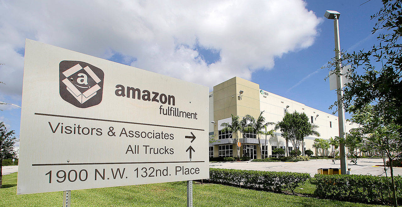An Amazon fulfillment Ccenter in Miami. Amazon says it’s looking to fill more than 50,000 positions across its U.S. (AP Photo/Alan Diaz)