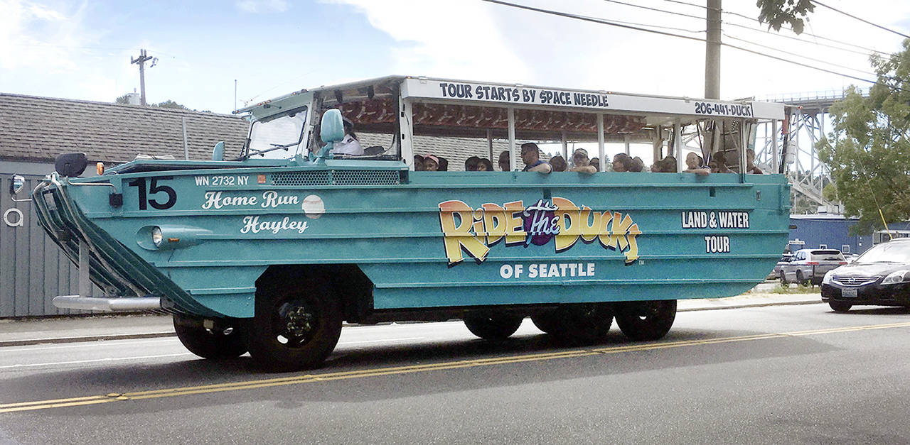 A Ride the Ducks boat (the non-stretch type) travels through the University District in Seattle on July 6. (Sue Misao / The Herald)