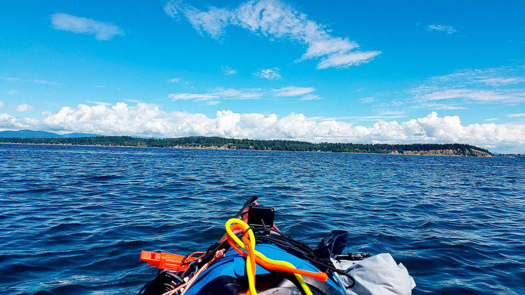 The author and his friends Brian Hoorn and April Forgey kayaked in June through some of the smaller San Juan Islands. (Aaron Swaney / For The Herald)
