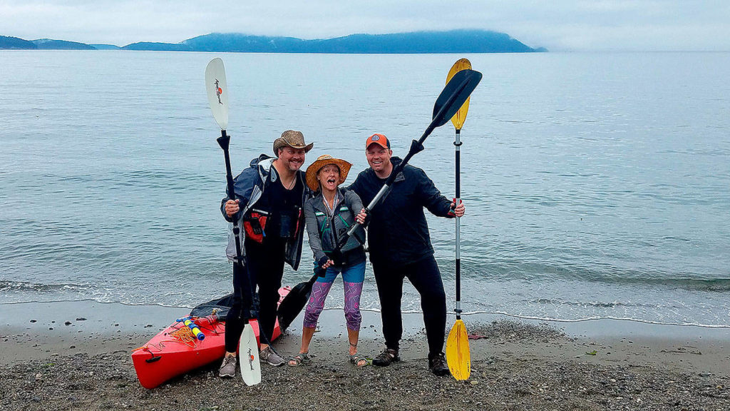 Brian Hoorn, April Forgey and Aaron Swaney stop kayaking to get a silly photo with their kayak gear. (Aaron Swaney / For The Herald)
