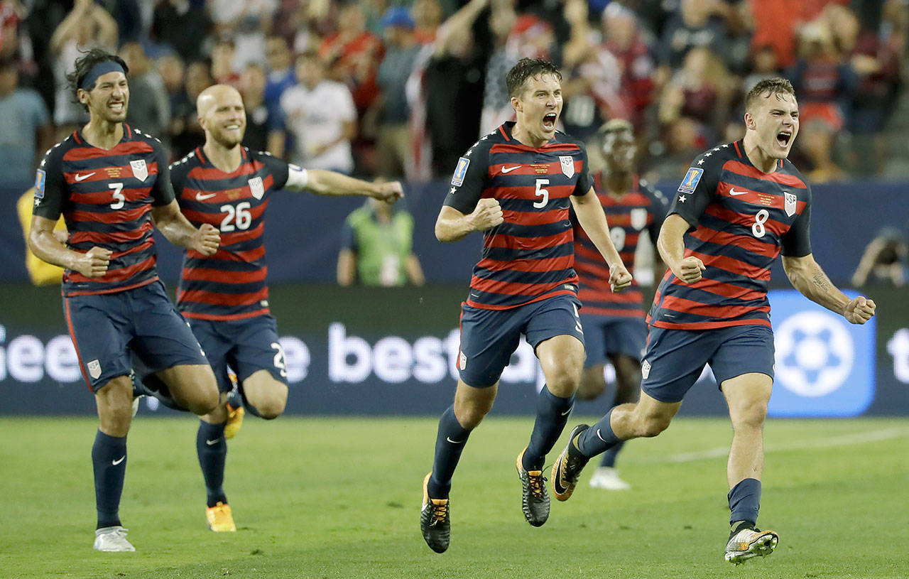 Jordan Morris (far right) celebrates with teammates after scoring the match-winning goal for the United States in its 2-1 victory over Jamaica in the Gold Cup final Wednesday in Santa Clara, California. (AP Photo/Marcio Jose Sanchez)