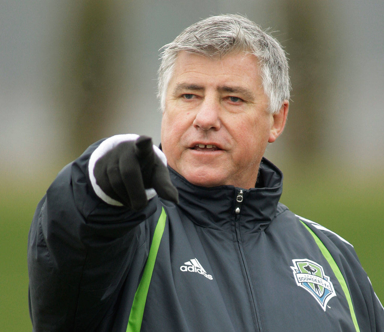 Former Sounders coach Sigi Schmid calls to his players during training camp on Jan. 21, 2009, in Renton. (AP Photo/Ted S. Warren)