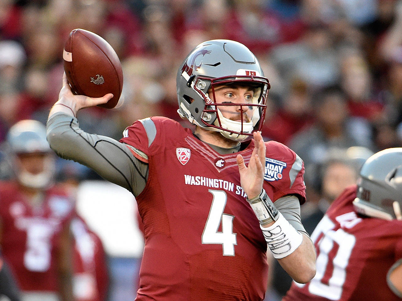 Washington State quarterback Luke Falk (4) passes during the first half of the Holiday Bowl against Minnesota on Dec. 27, 2016, in San Diego. (AP Photo/Denis Poroy)