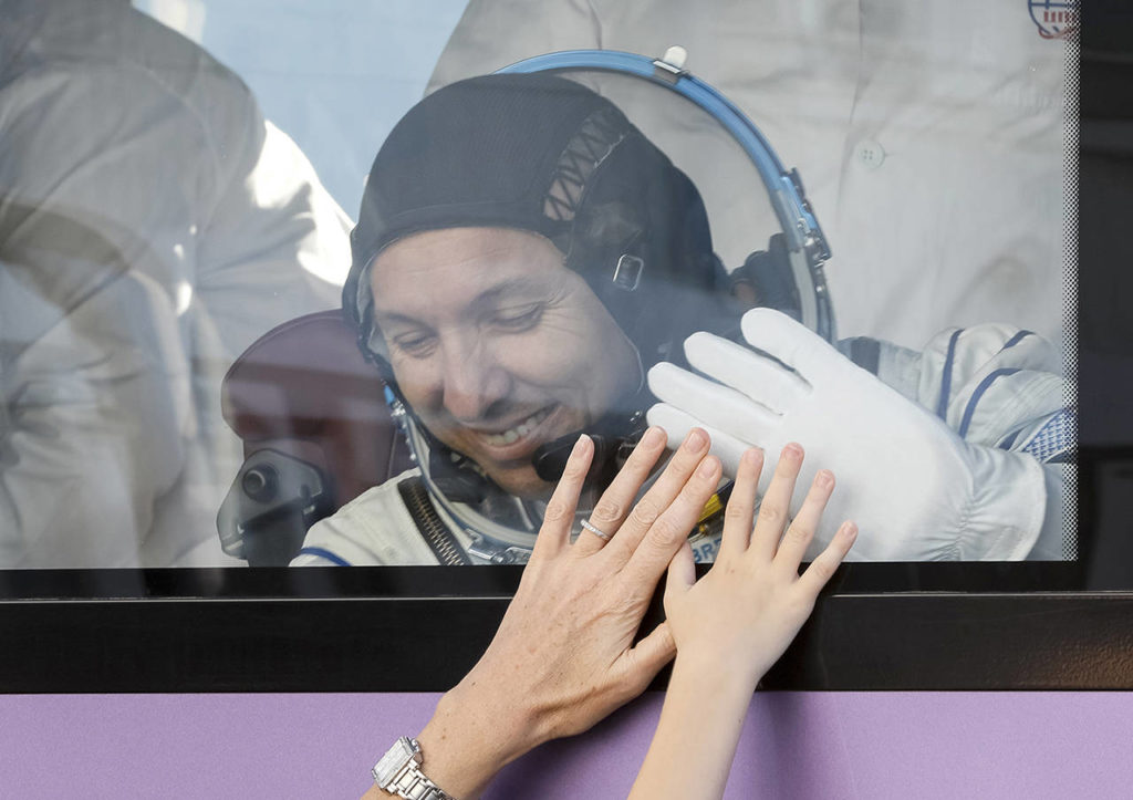 U.S. astronaut Randy Bresnik, member of the main crew of the expedition to the International Space Station (ISS), waves to his family from a bus prior the launch of Soyuz MS-05 space ship at the Russian leased Baikonur cosmodrome, Kazakhstan, on Friday. (AP Photo/Shamil Zhumatov, Pool)
